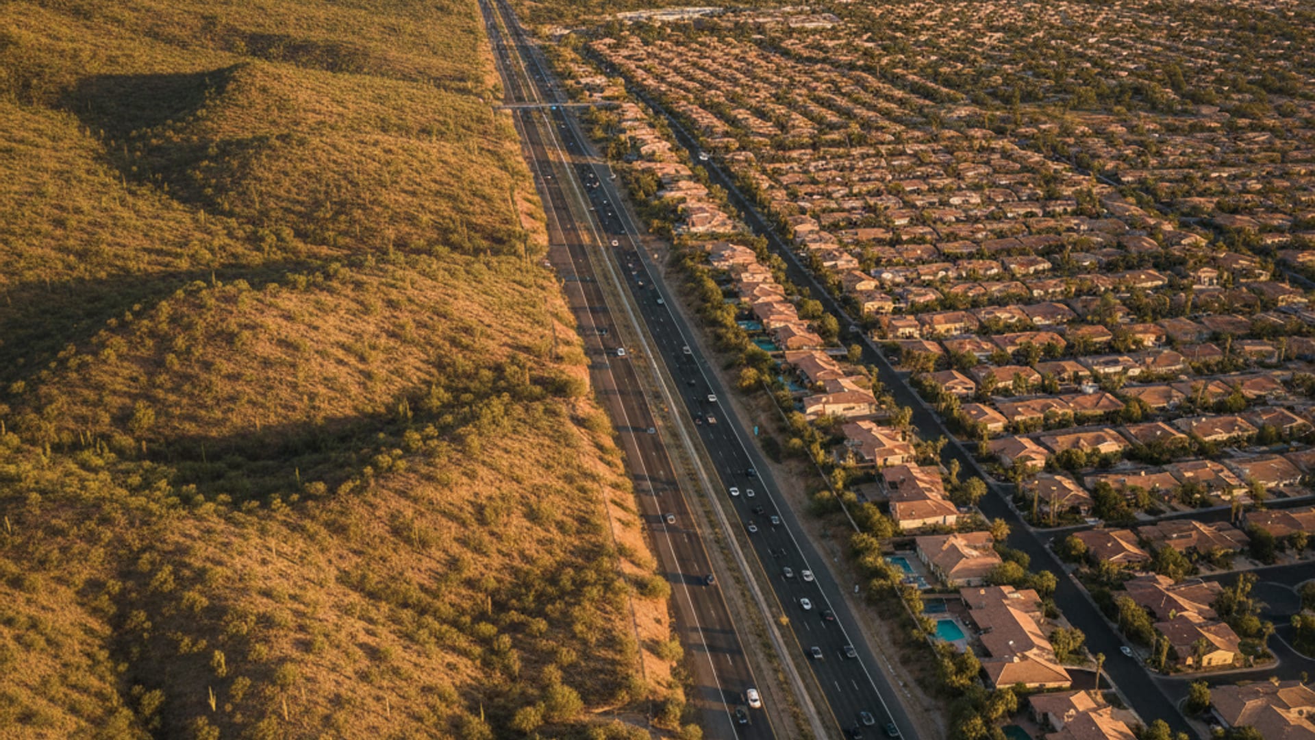 Aerial view of the Phoenix area freeway network at golden hour showing Glendale through Phoenix to Mesa